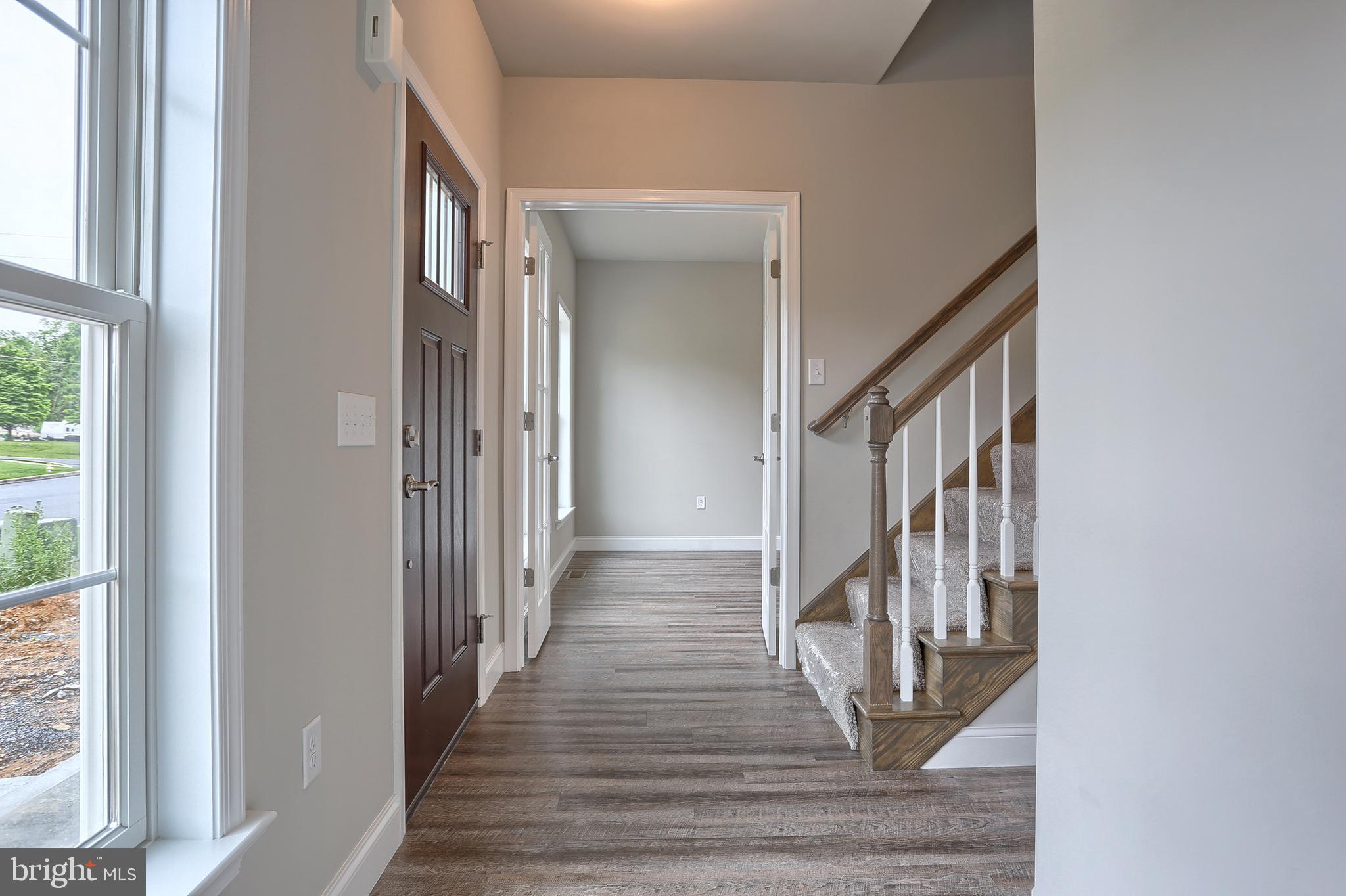 3 Rolling Meadow Road Lebanon, PA 17046 - Photo 2 of 34 a view of a hallway with wooden floor and staircase