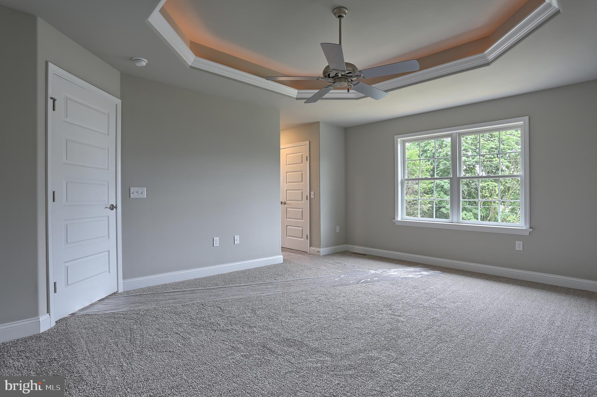 3 Rolling Meadow Road Lebanon, PA 17046 - Photo 25 of 34 en empty room with windows and chandelier fan
