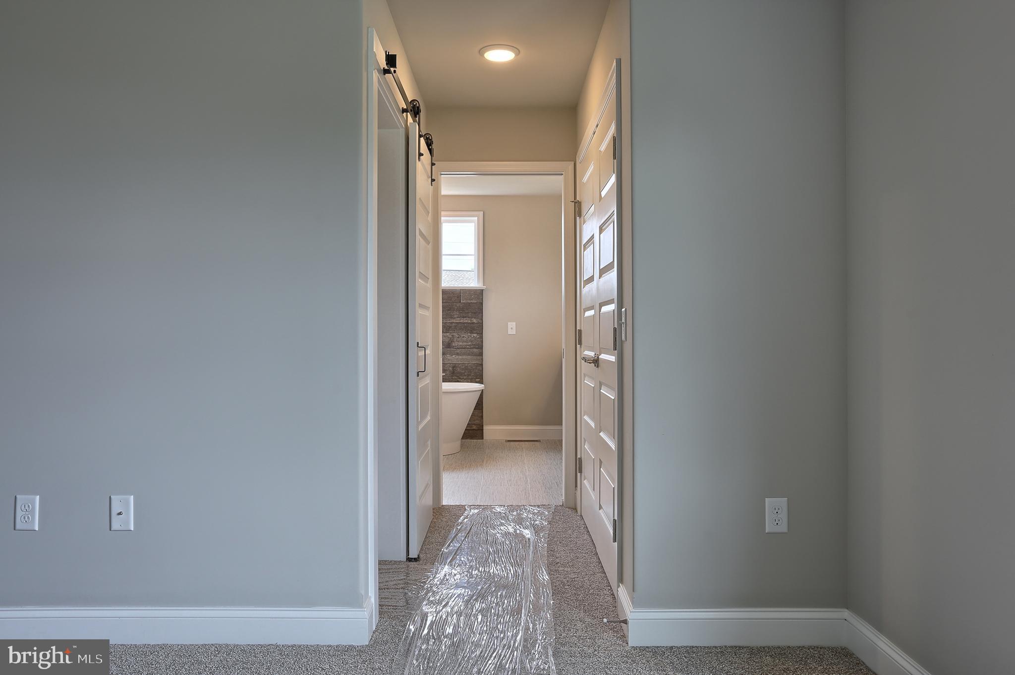 3 Rolling Meadow Road Lebanon, PA 17046 - Photo 27 of 34 a view of a hallway with wooden floor and a bathroom