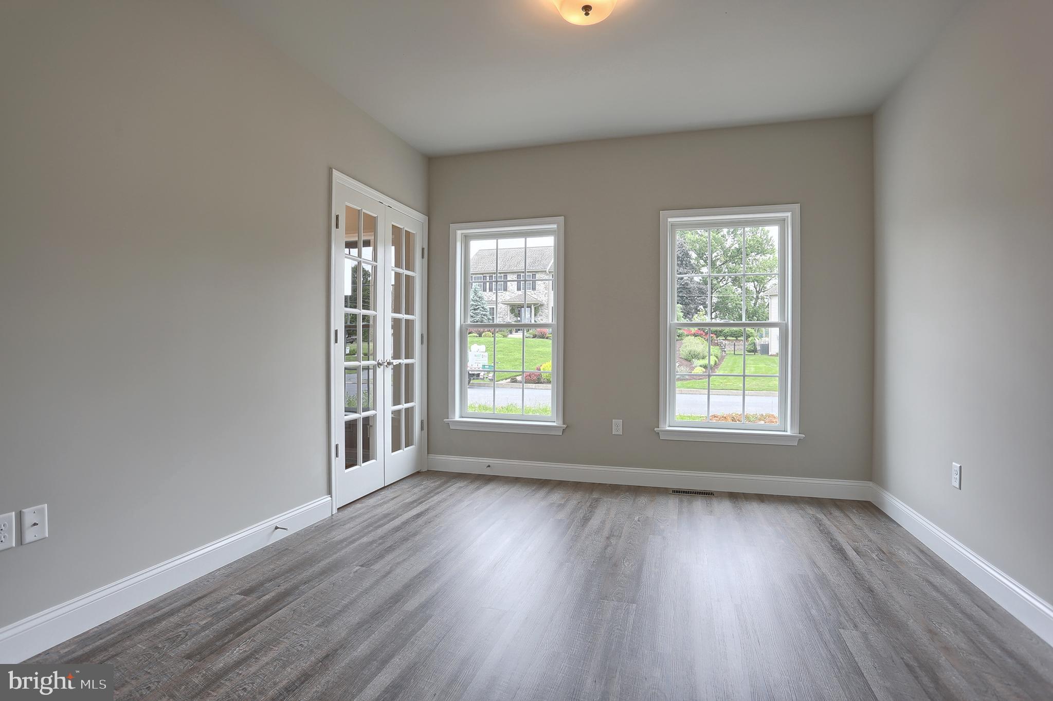 3 Rolling Meadow Road Lebanon, PA 17046 - Photo 6 of 34 an empty room with wooden floor and windows