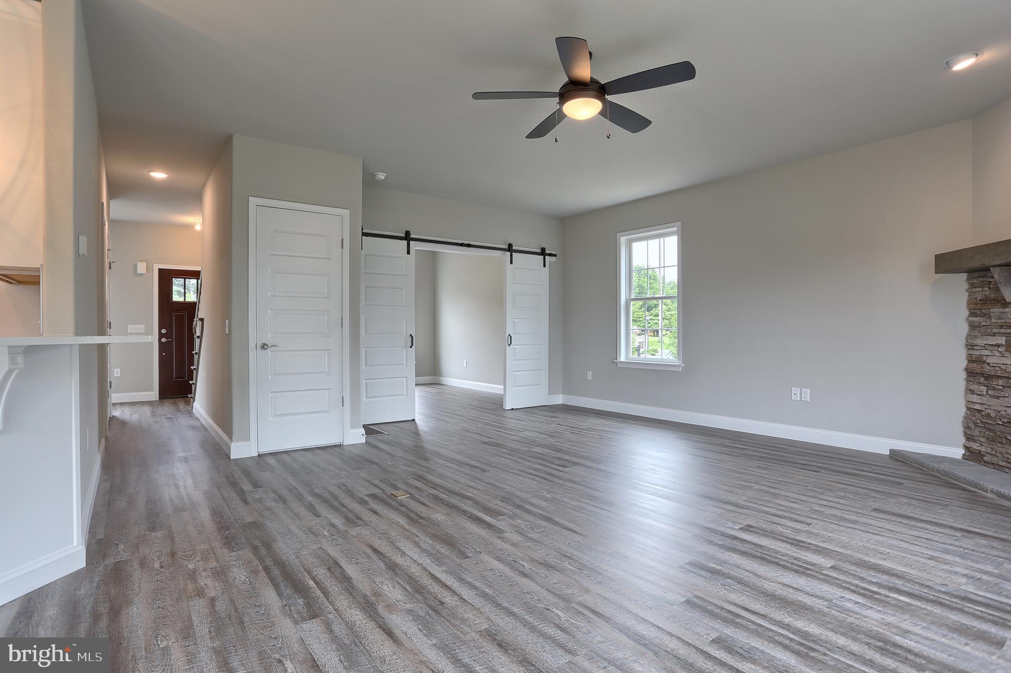 3 Rolling Meadow Road Lebanon, PA 17046 - Photo 10 of 34 a view of an empty room with window and wooden floor