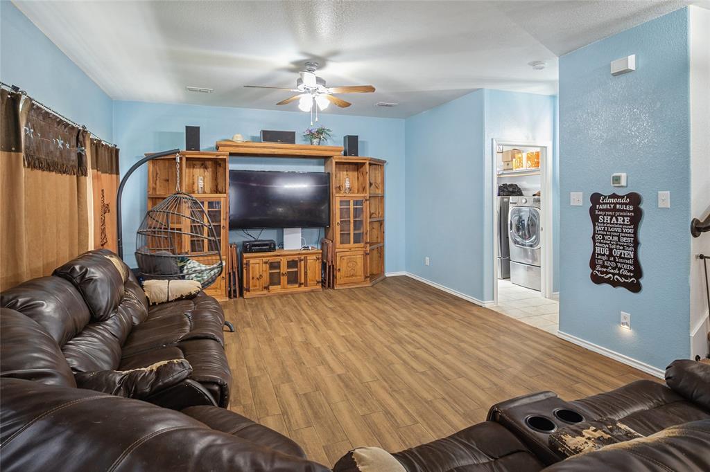 324 Fairgrounds Lane Ponder, TX 76259 - Photo 6 of 40 a living room with furniture and a flat screen tv
