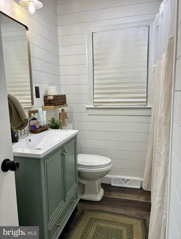 a bathroom with a toilet and a sink