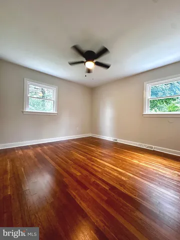 a view of room window and wooden floor