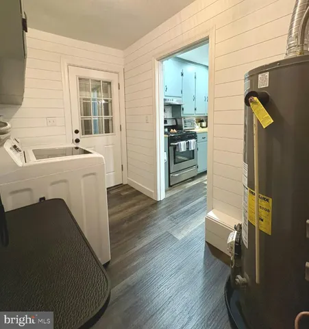a view of kitchen with furniture and wooden floor