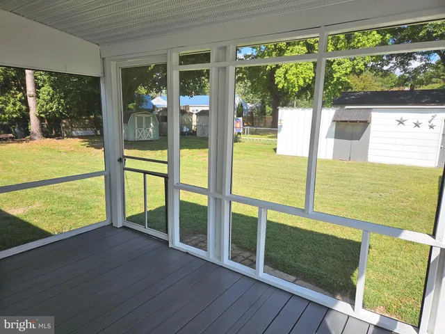 a view of an ocean from a floor to ceiling window
