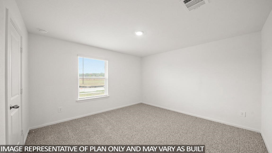 15565 Granger Grn Way Conroe, TX 77302 - Photo 5 of 24 an empty room with windows