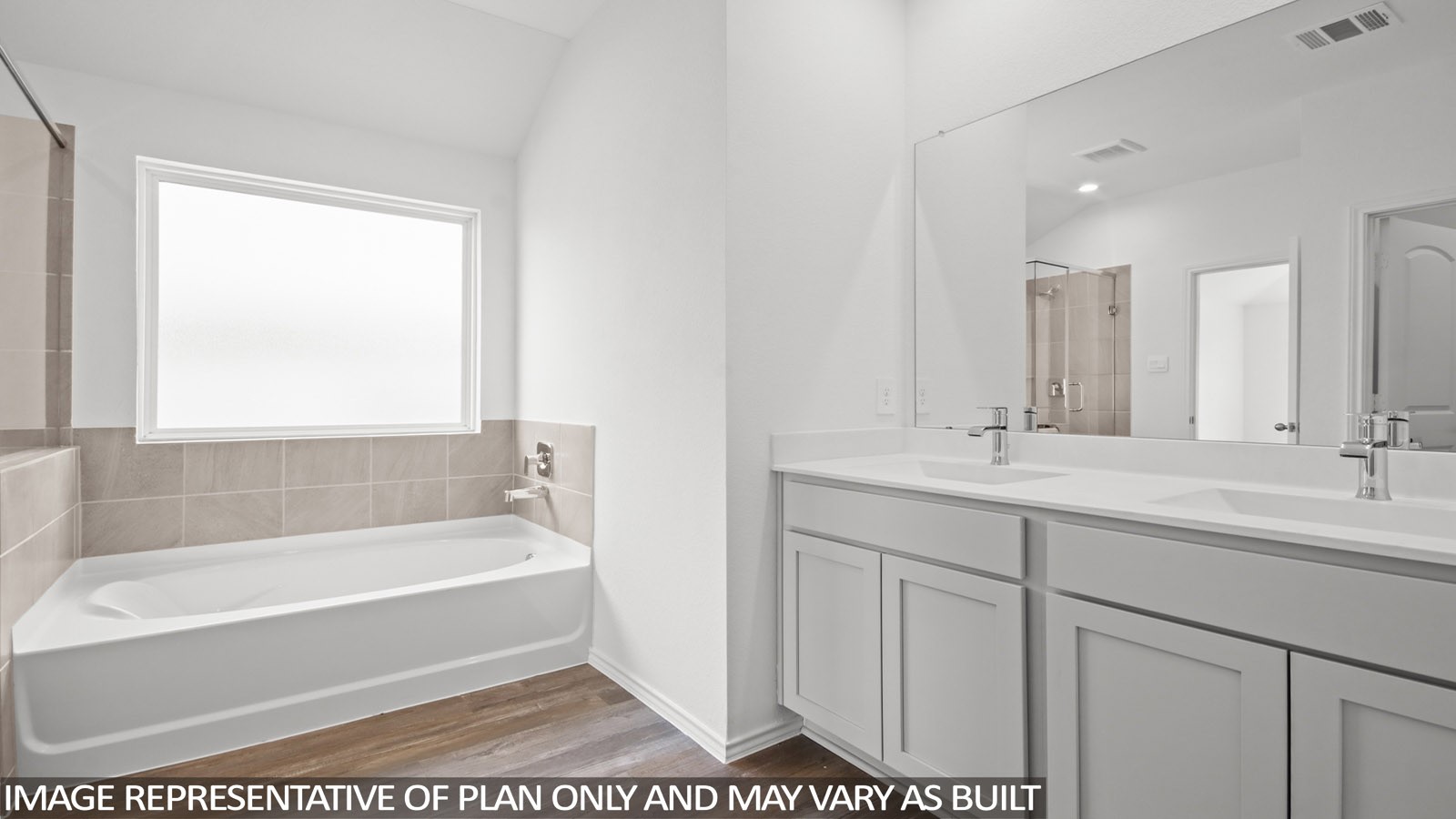 15565 Granger Grn Way Conroe, TX 77302 - Photo 9 of 24 a bathroom with a tub sink and mirror