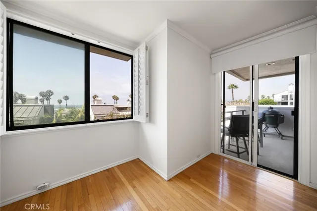 a view of a room with wooden floor and walls