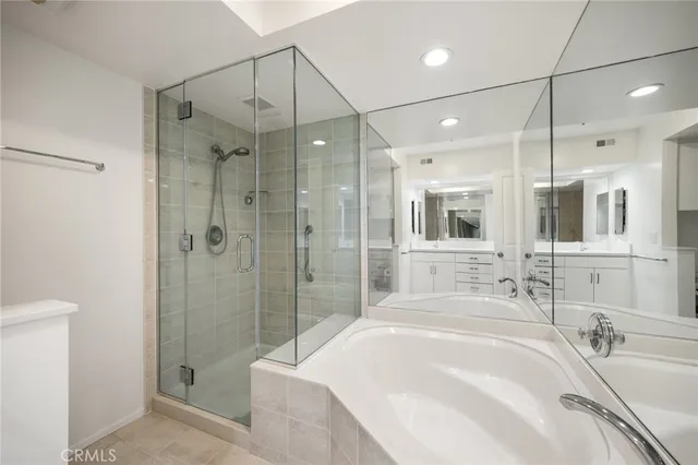 a spacious bathroom with a sink a toilet and shower