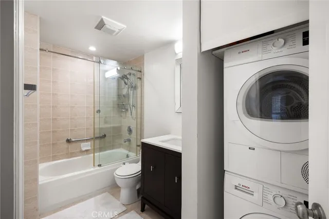 a bathroom with a toilet a sink and bathtub