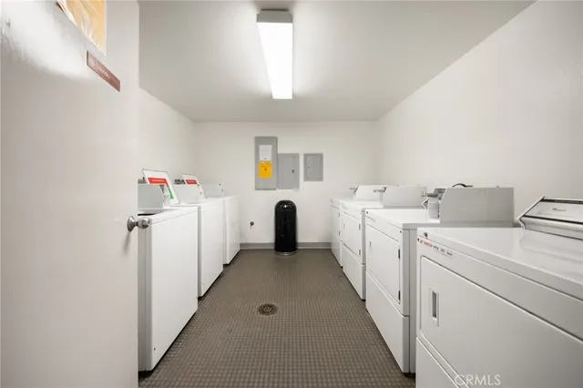 a view of storage and utility room with washer and dryer