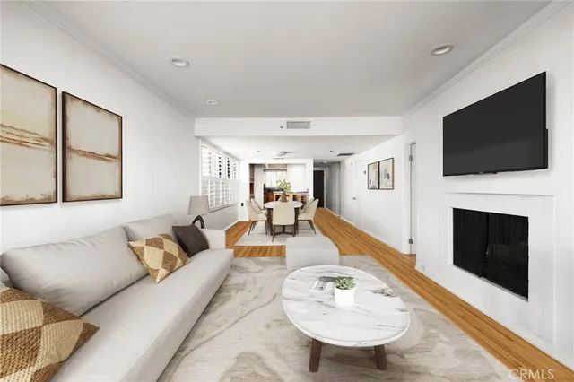 a living room with fireplace furniture and a flat screen tv