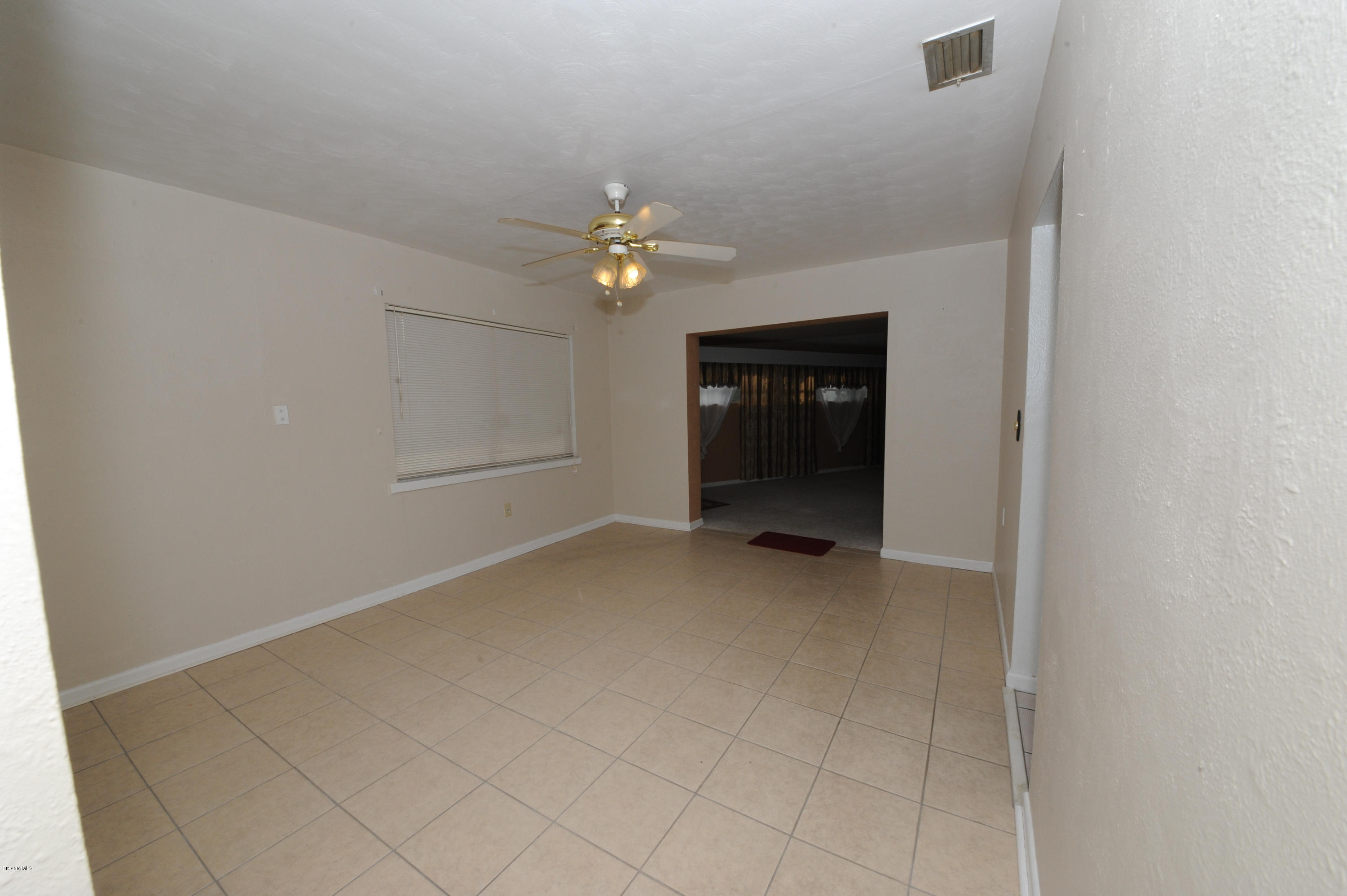 1014 Woodlawn Road Rockledge, FL 32955 - Photo 11 of 42 Formal Dining Room - View 2