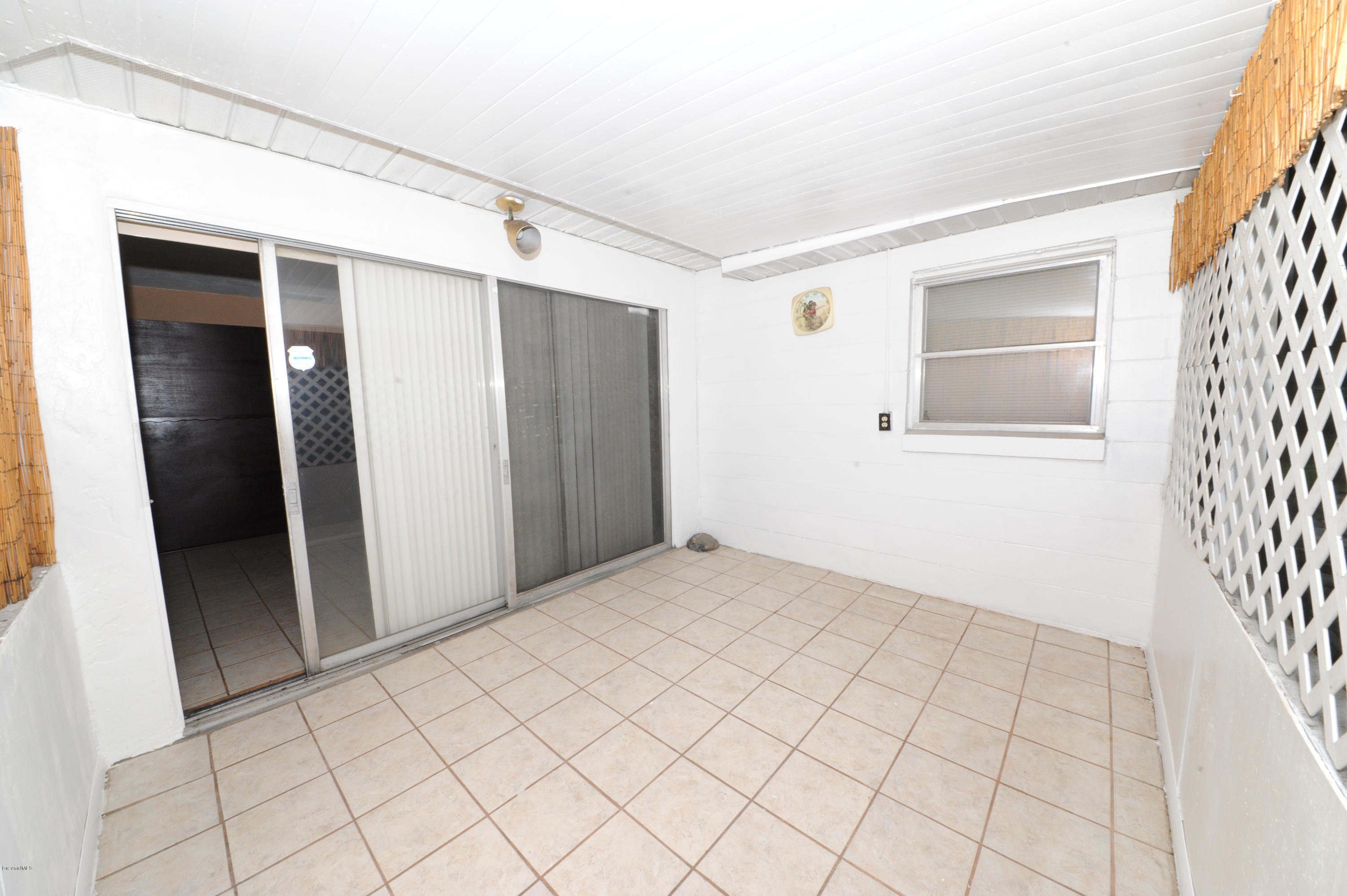1014 Woodlawn Road Rockledge, FL 32955 - Photo 28 of 42 Enclosed Porch - View 2