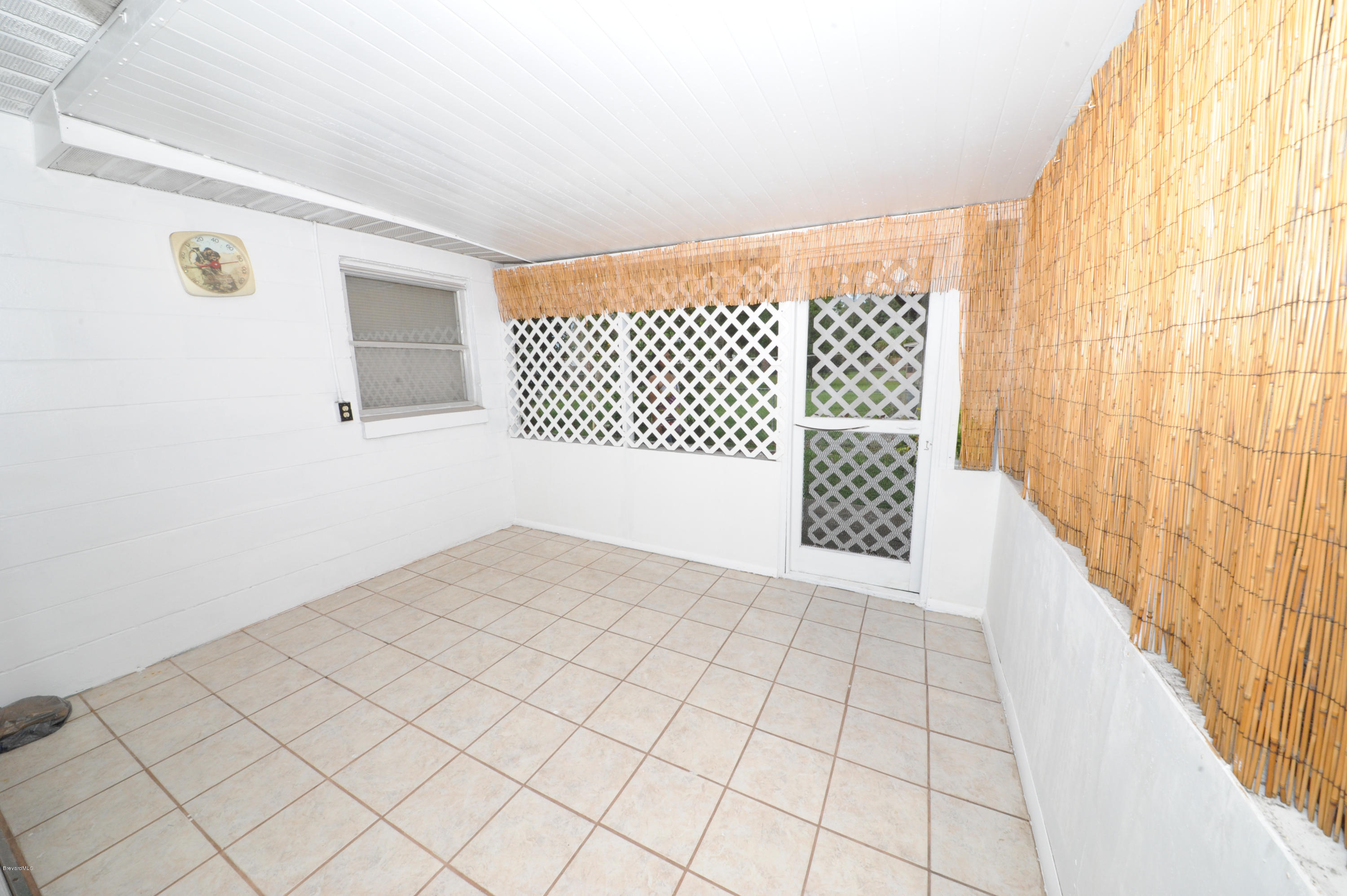 1014 Woodlawn Road Rockledge, FL 32955 - Photo 29 of 42 Enclosed Porch - View 1