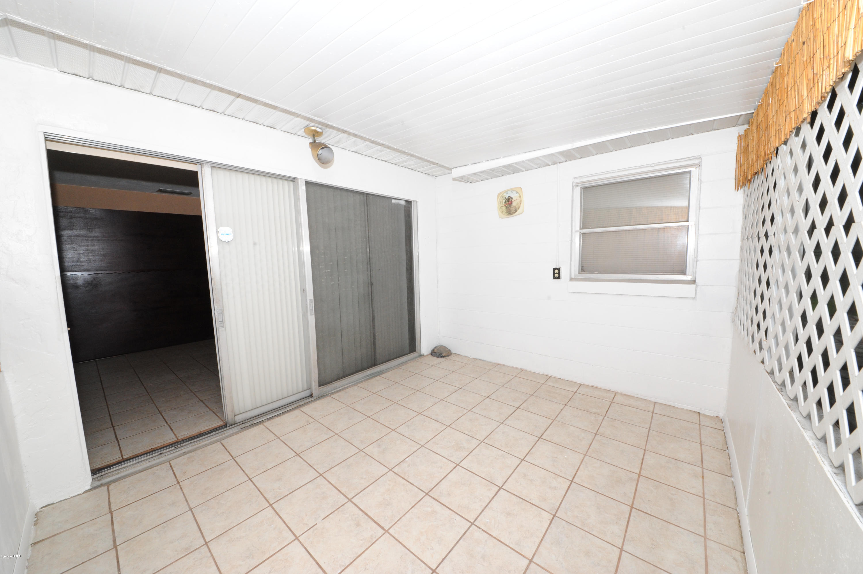 1014 Woodlawn Road Rockledge, FL 32955 - Photo 30 of 42 Enclosed Porch - View 3