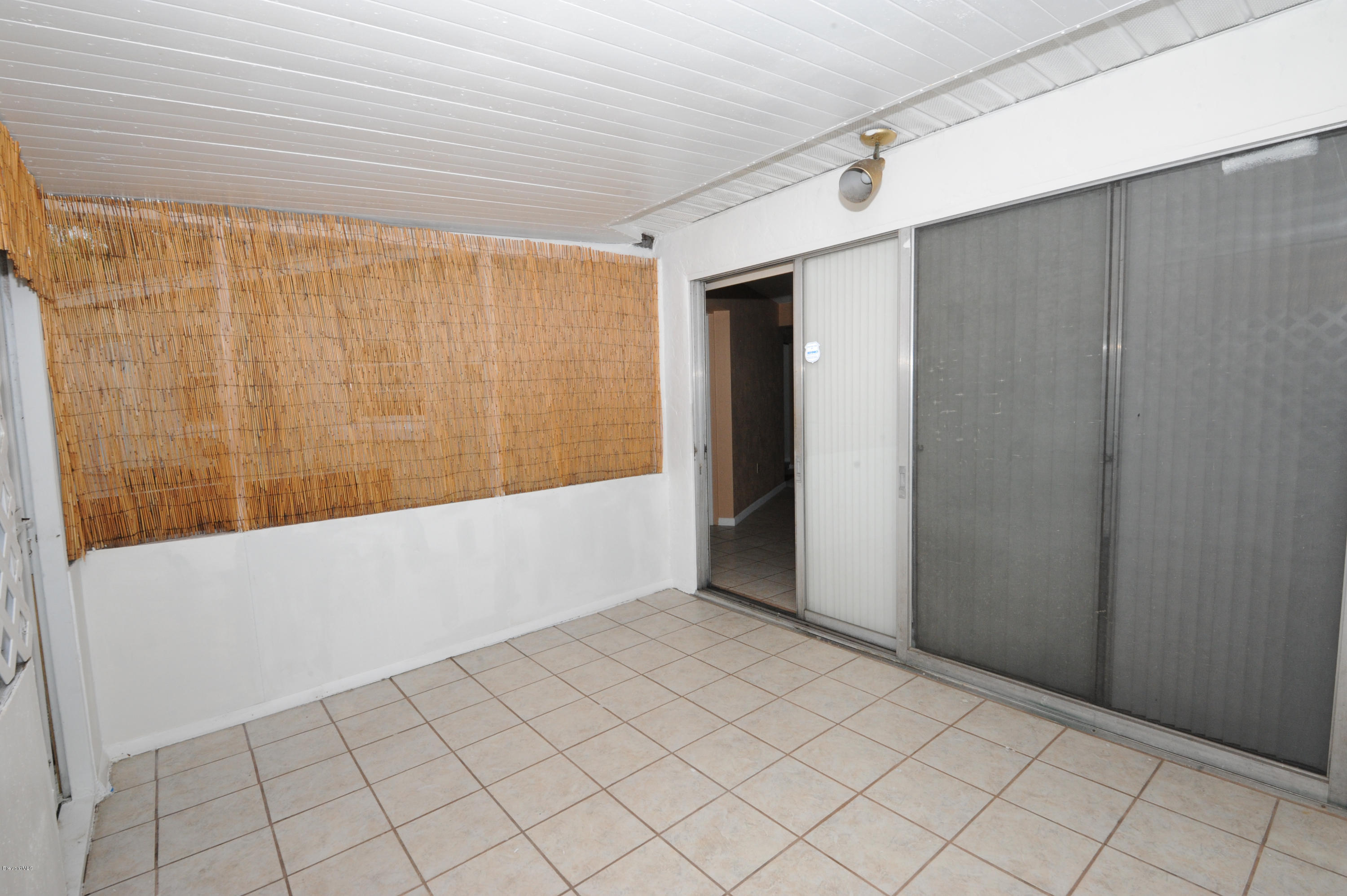 1014 Woodlawn Road Rockledge, FL 32955 - Photo 31 of 42 Enclosed Porch - View 4