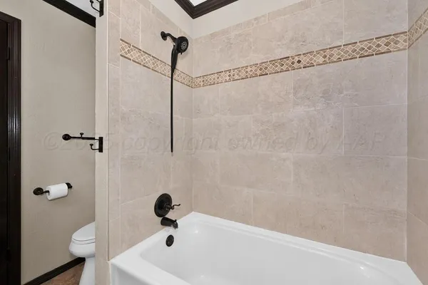 a bathroom with a shower and toilet