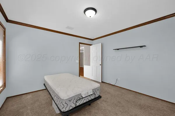 a room with a bed and a window