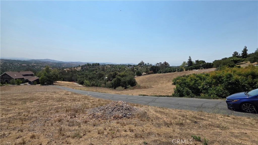 4140 Meredith Road Fallbrook, CA 92028 - Photo 4 of 12 a view of dirt road with a building in the background