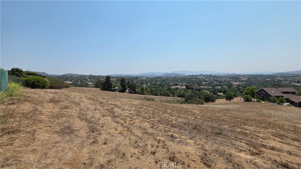 4140 Meredith Road Fallbrook, CA 92028 - Photo 6 of 12 a view of a dry yard with wooden fence