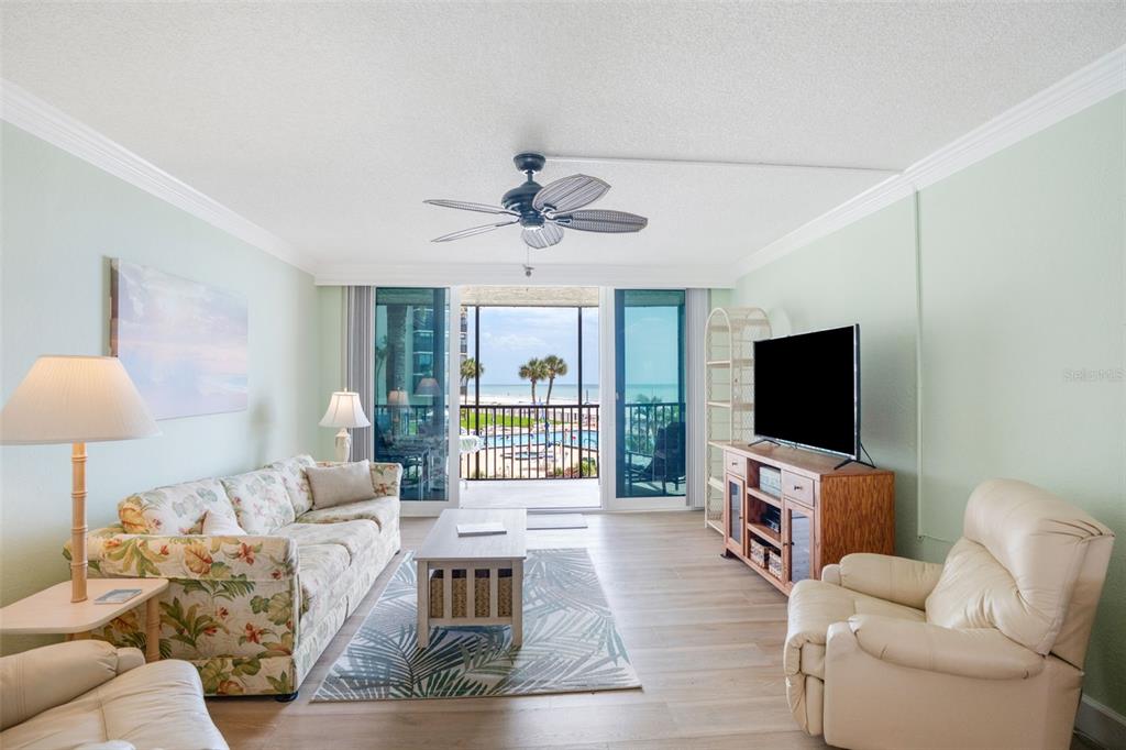 18304 Gulf Boulevard, Unit 105 Redington Shores, FL 33708 - Photo 12 of 33 a living room with furniture and a flat screen tv