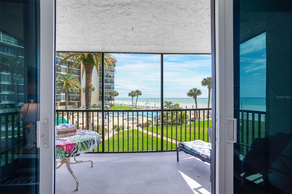 18304 Gulf Boulevard, Unit 105 Redington Shores, FL 33708 - Photo 13 of 33 a view of a porch with a yard