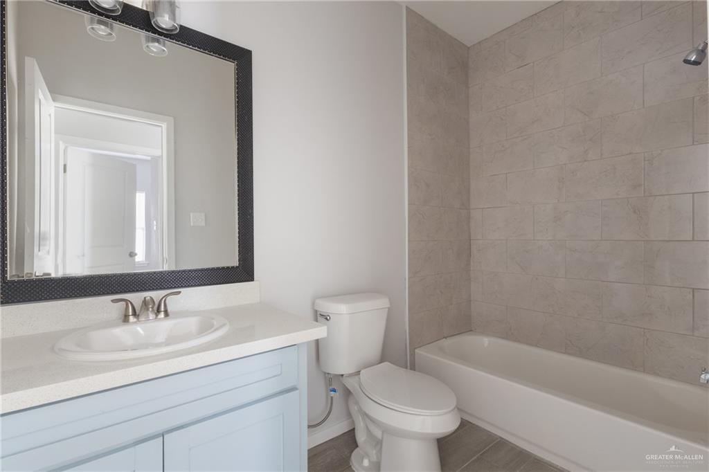 340 Eva Street Elsa, TX 78543 - Photo 8 of 12 a bathroom with a sink toilet and bathtub