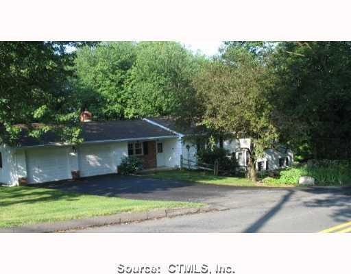545 Park Rd Extension Middlebury, CT 06762 - Photo 1 of 1 a house view with a garden space