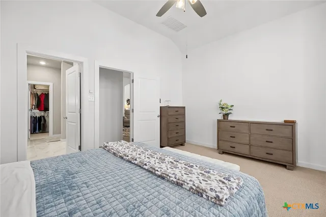 a bedroom with a bed and a dresser