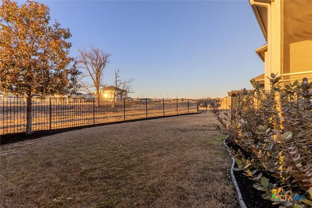 a front view of a house with plants