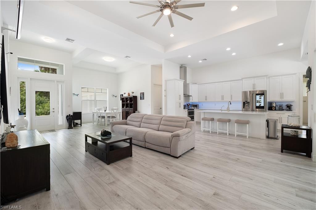 693 7th Street Northwest Naples, FL 34120 - Photo 12 of 32 a living room with furniture and a large window