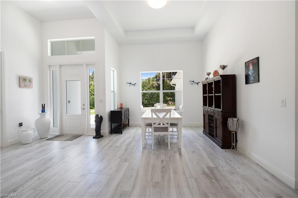 693 7th Street Northwest Naples, FL 34120 - Photo 14 of 32 a living room with furniture and a wooden floor