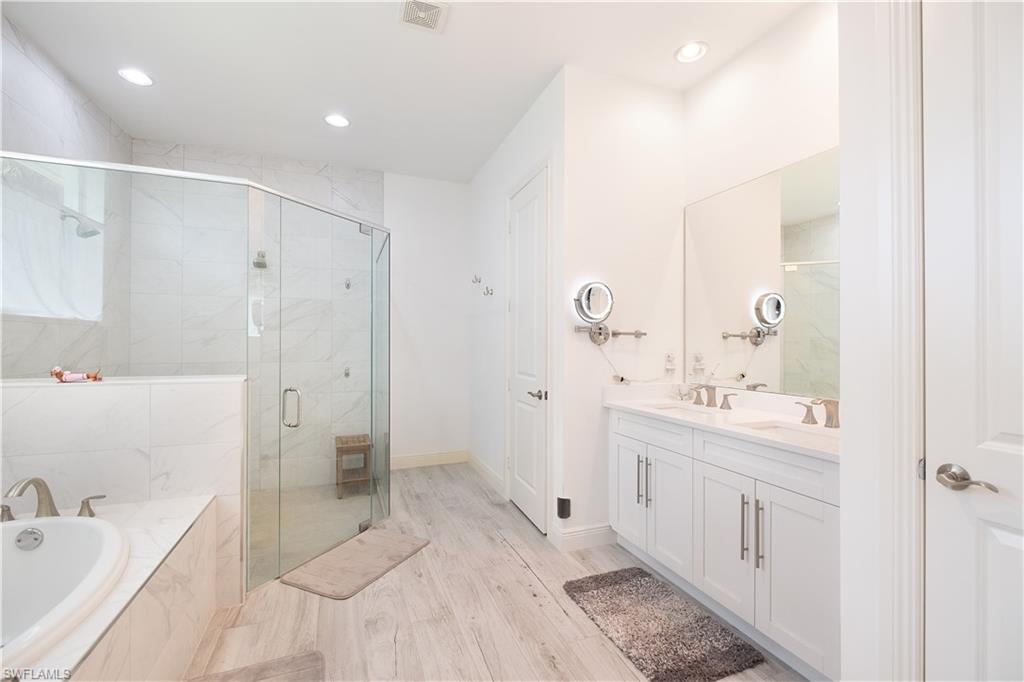 693 7th Street Northwest Naples, FL 34120 - Photo 17 of 32 a bathroom with a sink a toilet and shower