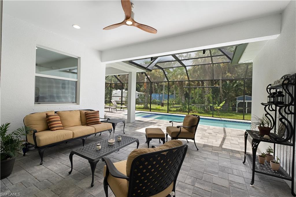 693 7th Street Northwest Naples, FL 34120 - Photo 23 of 32 a living room with furniture and a large window