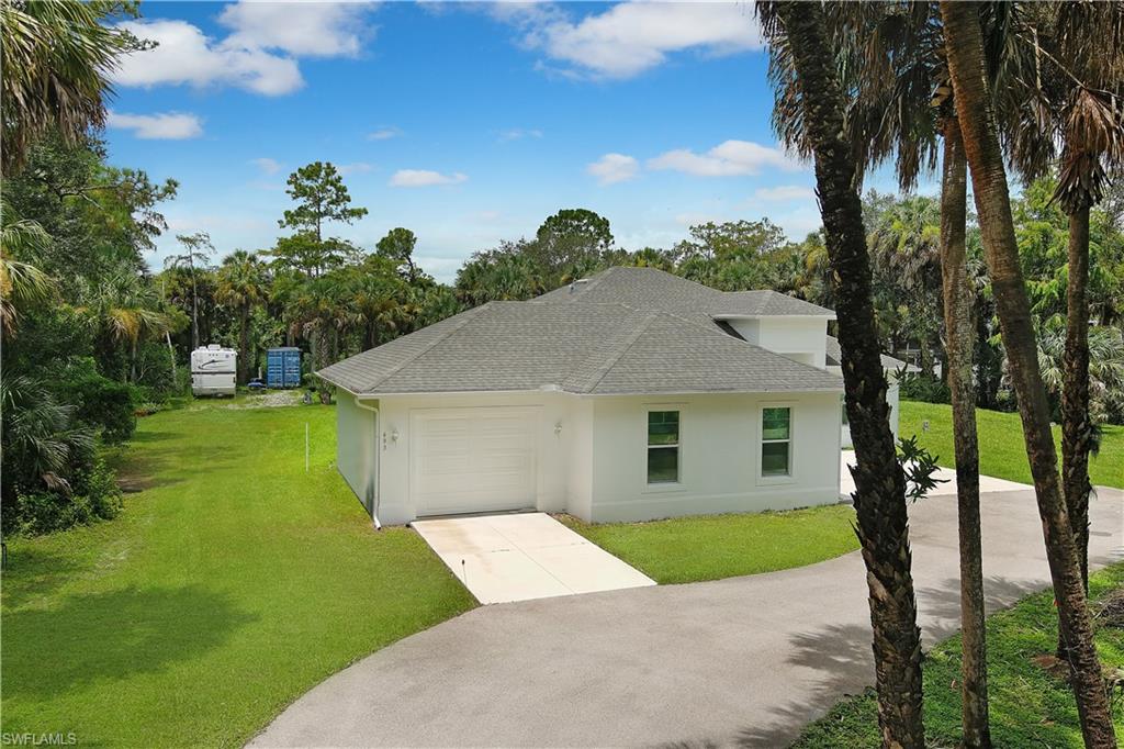693 7th Street Northwest Naples, FL 34120 - Photo 32 of 32 a view of outdoor space yard and front view of a house