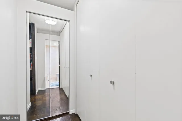 a bathroom with a sink toilet and a mirror