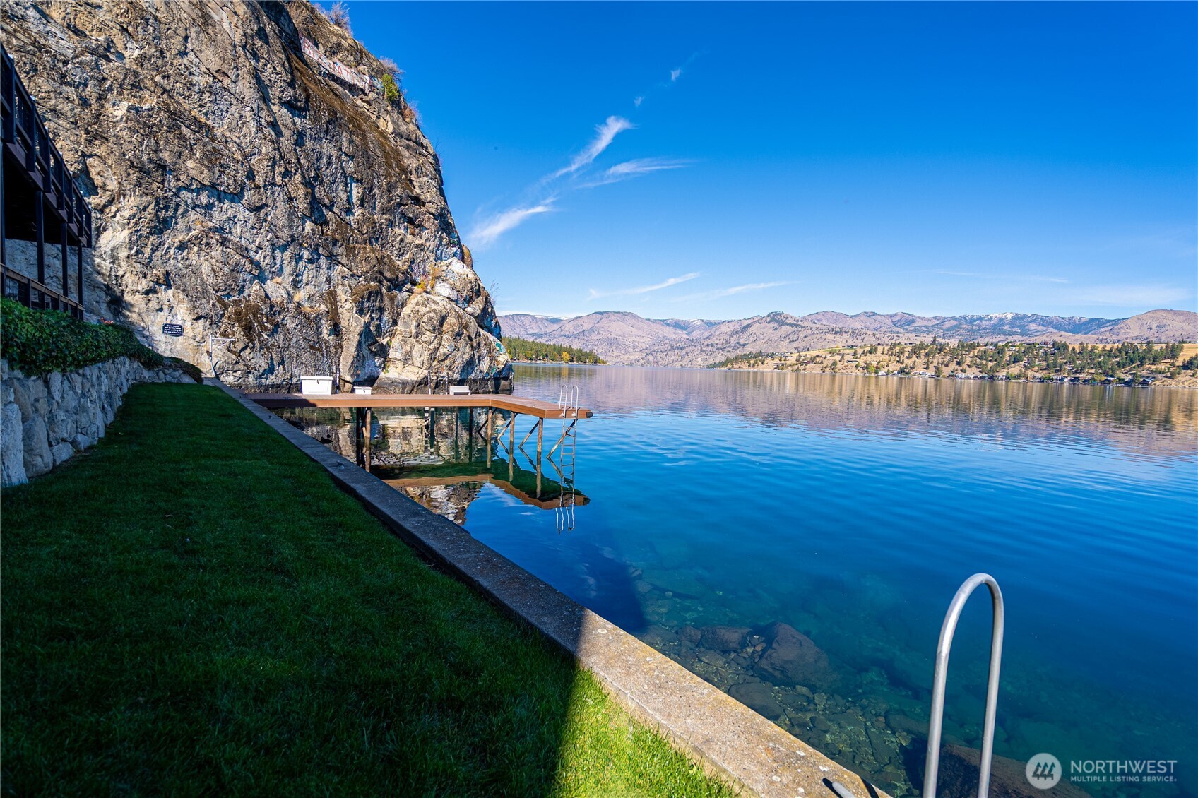 10370 South Lakeshore Road Chelan, WA 98816 - Photo 15 of 31 a view of a lake with a mountain