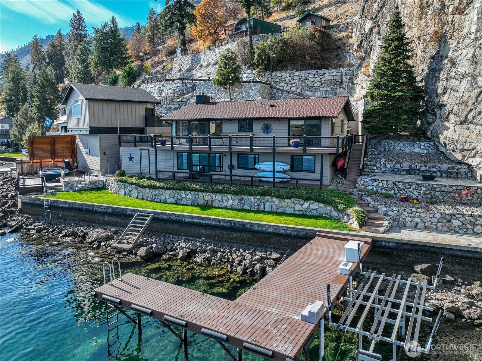 10370 South Lakeshore Road Chelan, WA 98816 - Photo 3 of 31 a view of a swimming pool with a patio and a yard