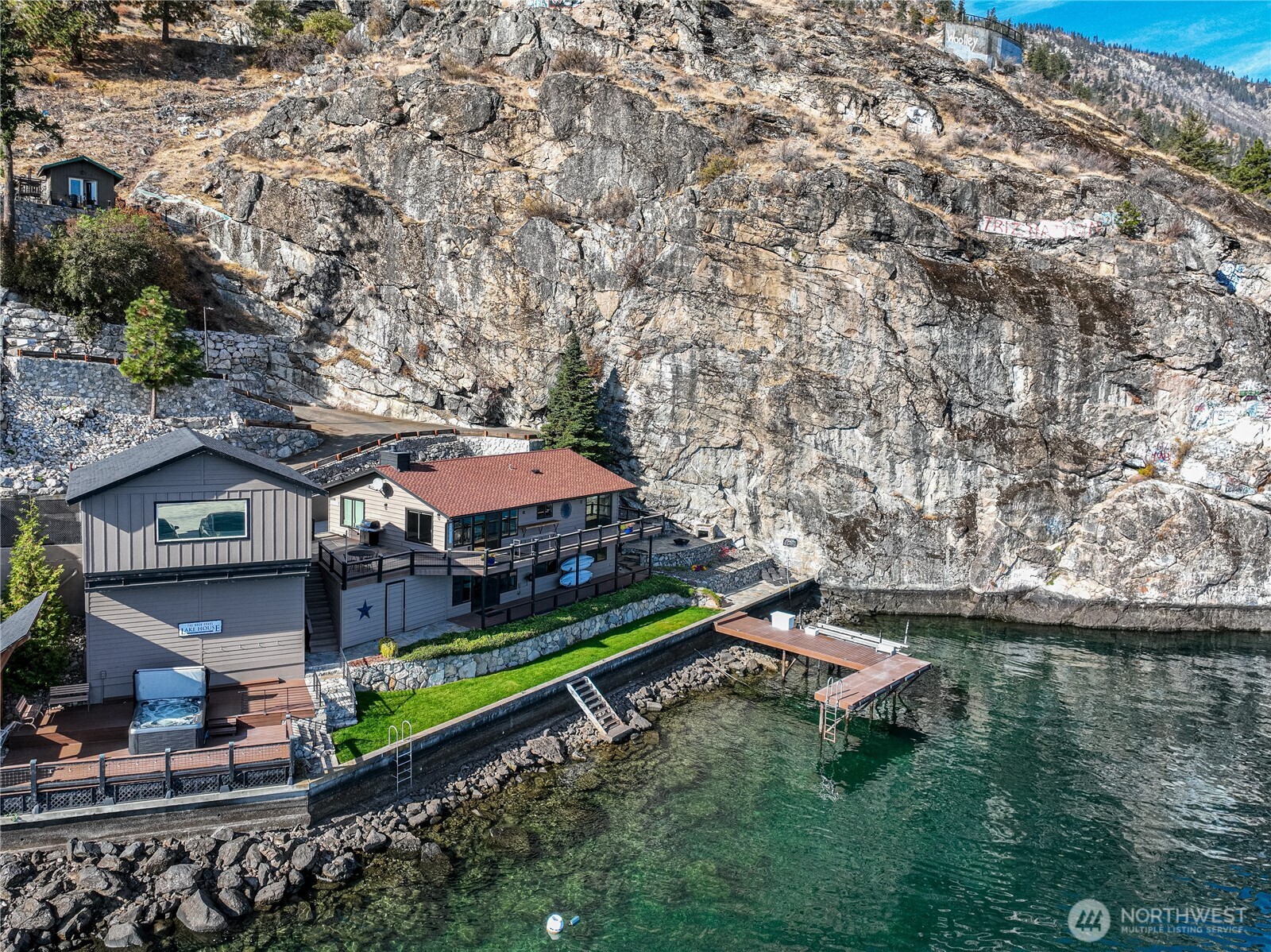 10370 South Lakeshore Road Chelan, WA 98816 - Photo 4 of 31 an aerial view of a house with a yard from a lake view