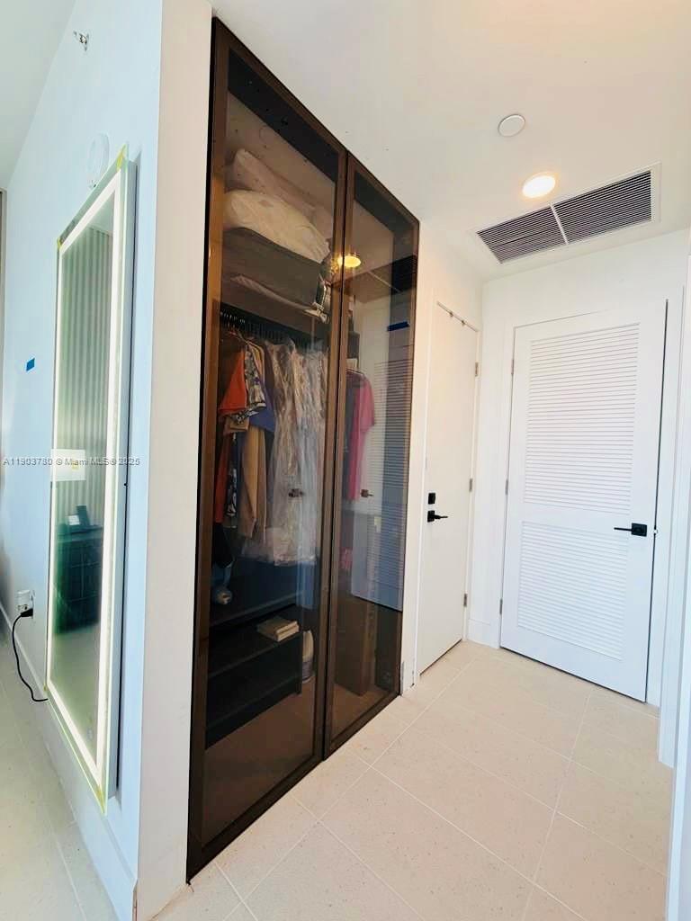 159 Northeast 6th Street, Unit PH5014 Miami, FL 33132 - Photo 18 of 41 a view of closet area
