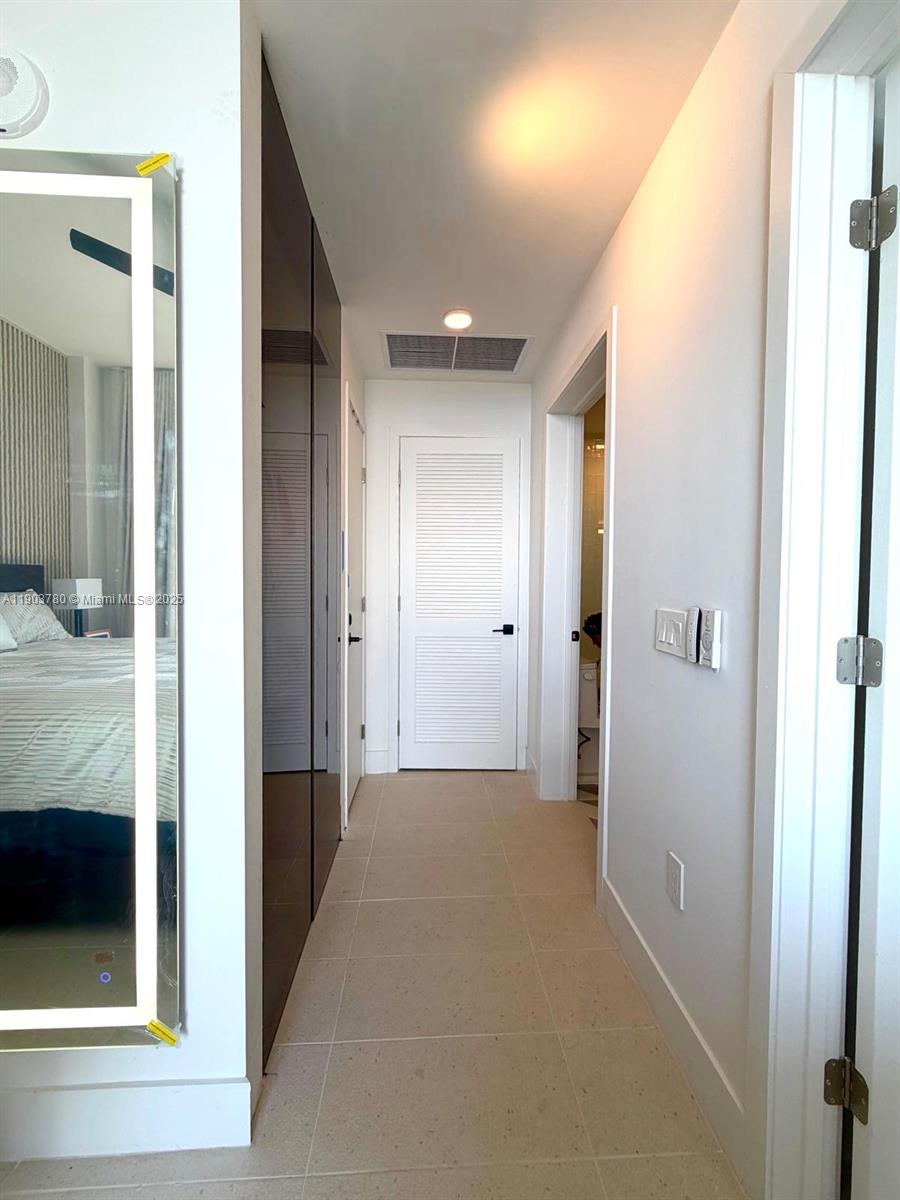 159 Northeast 6th Street, Unit PH5014 Miami, FL 33132 - Photo 21 of 41 a view of a hallway with a elevator