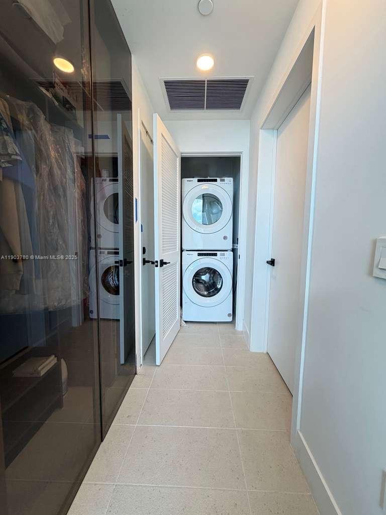 159 Northeast 6th Street, Unit PH5014 Miami, FL 33132 - Photo 25 of 41 a view of a hallway with wooden shelves
