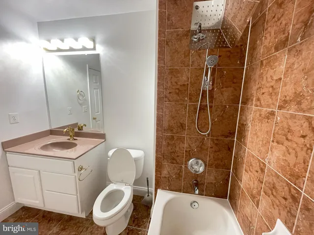 a bathroom with a sink a bathtub and a shower