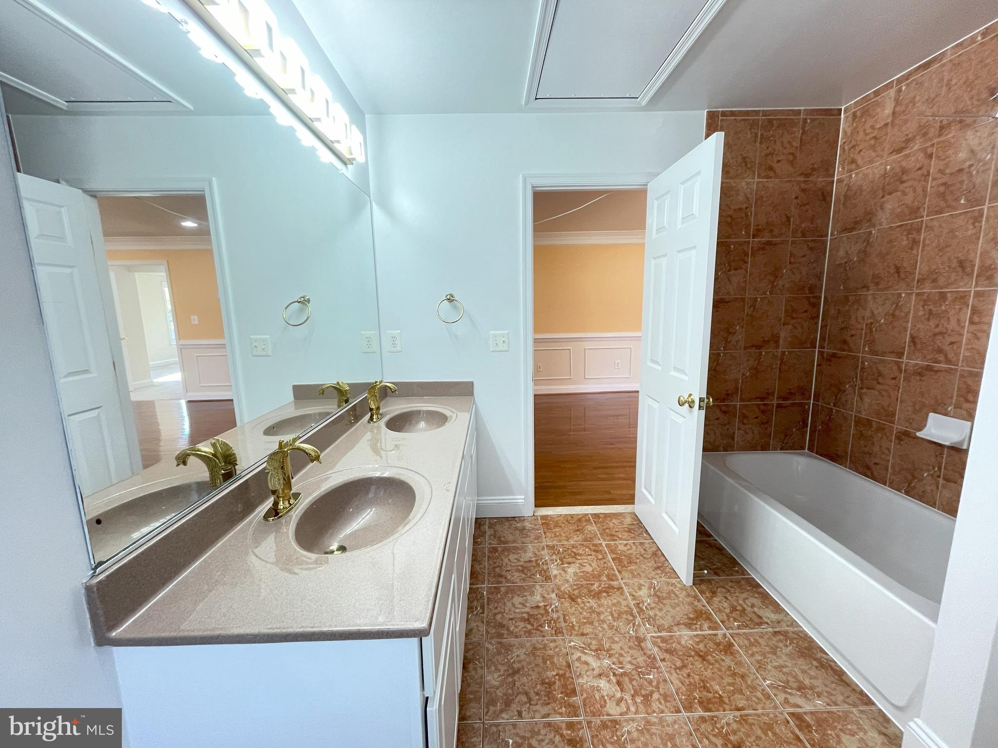 7212 Highland Street Springfield, VA 22150 - Photo 34 of 60 a bathroom with a sink a bathtub and a shower