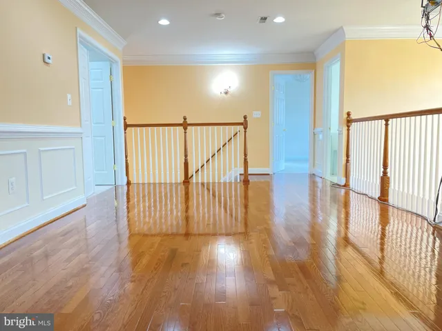a view of a white house with large windows