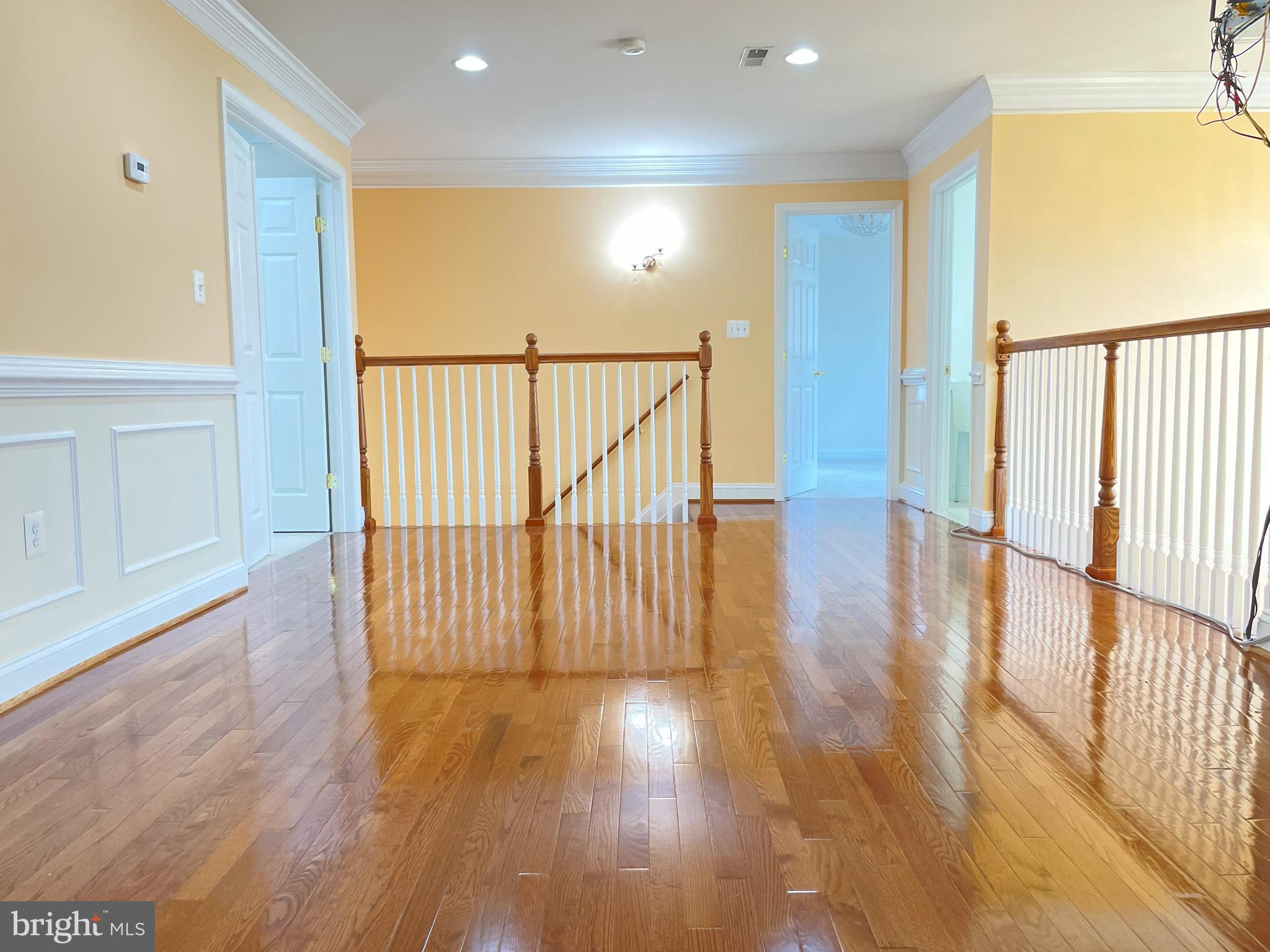 7212 Highland Street Springfield, VA 22150 - Photo 38 of 60 a view of a hallway with wooden floor