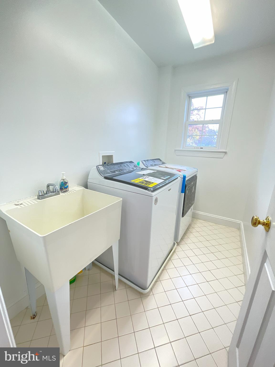7212 Highland Street Springfield, VA 22150 - Photo 39 of 60 a kitchen with stainless steel appliances a stove a sink and white cabinets