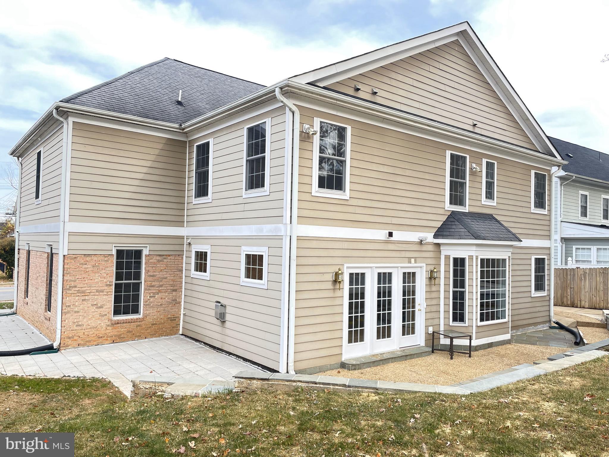 7212 Highland Street Springfield, VA 22150 - Photo 46 of 60 a front view of a house with a yard and garage